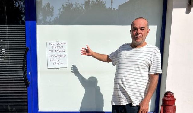 Sıcaktan bunalan esnaf, dükkanı kapatıp tatile çıktı