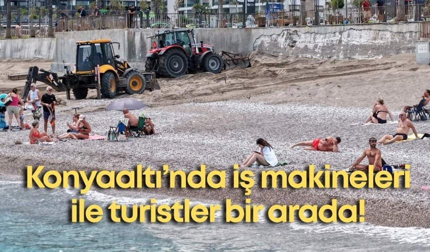 Konyaaltı Sahili'nde iş makineleri ile turistler bir arada!